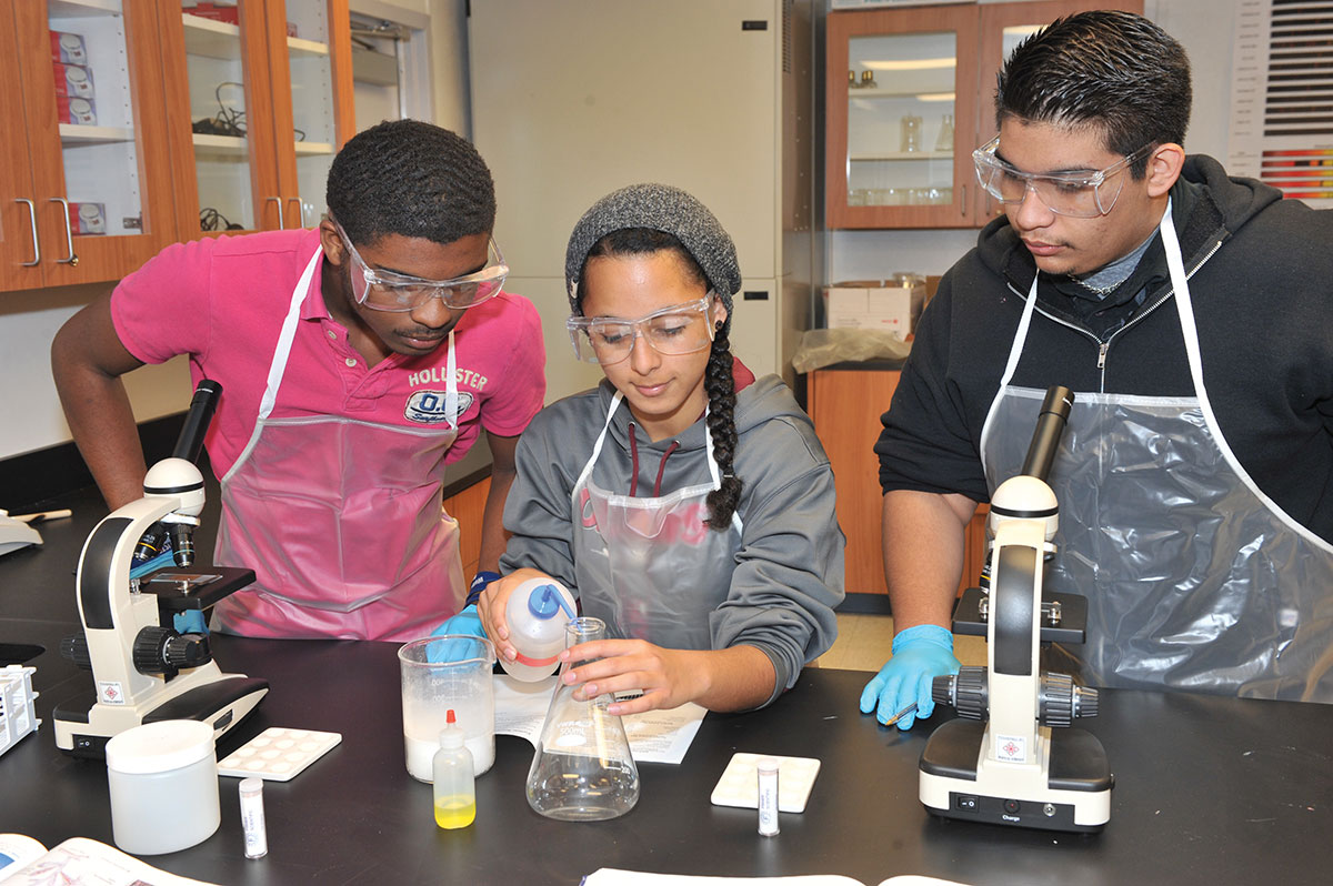 Jonathan Marr, Lauren Martinez and David Perez spend hands-on time in science classes