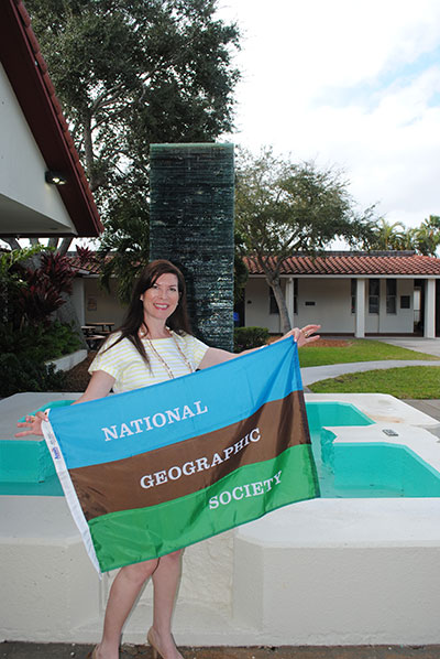 Monahan proudly displays her National Geographic Society banner.