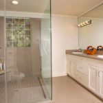 A guest bathroom, remodeled by a previous owner, is just one of the seven bathrooms in this home.