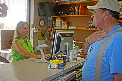 Owner Mary Loper rings up a sale