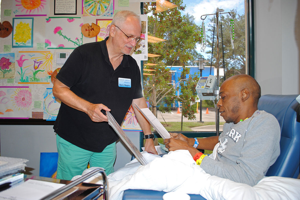 Artist Barry Shapiro helps patient Antonio Jenkins
