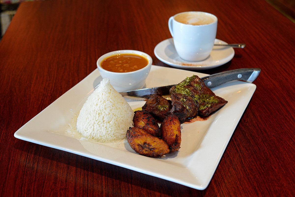 The juicy churasco with chimichurri sauce goes perfectly with platanos maduros (sweet fried plantains) and arroz con habichuelas (rice and beans).