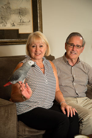 Barb and Dan Hazard enjoy their African grey parrot, Juliet, a retirement gift.