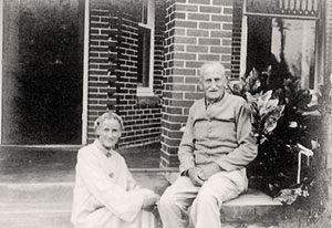 Ruth Hallstrom sits on the front porch with her father, Axel Hallstrom.