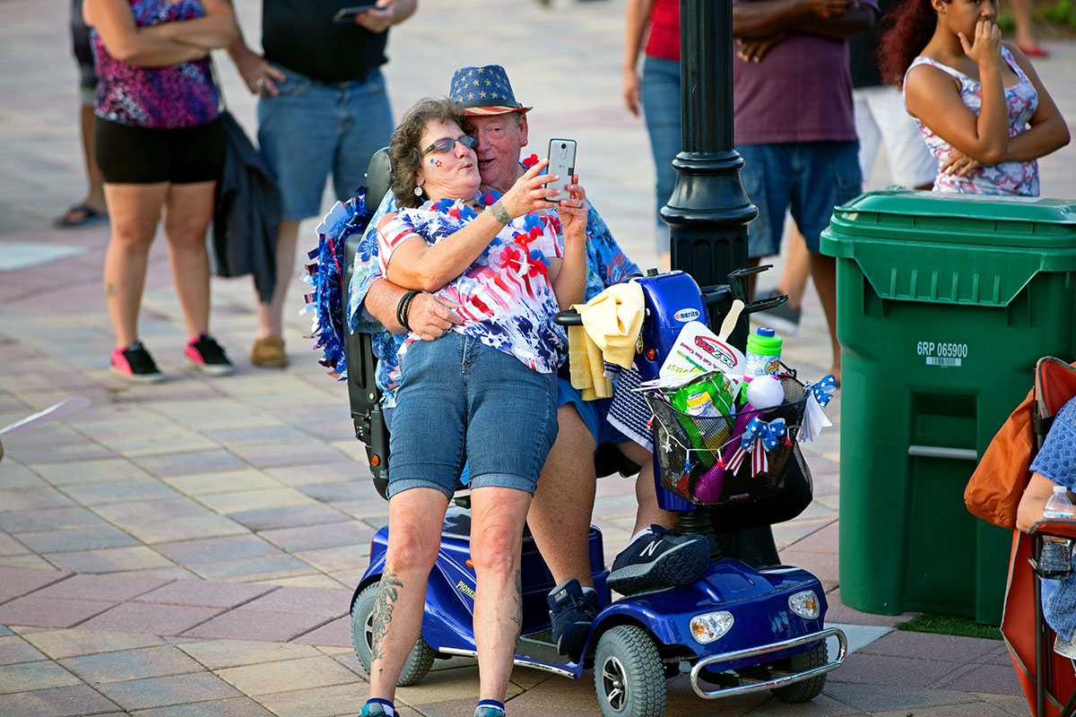 couple makes good use of a mobility scooter