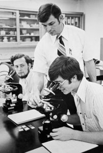 Dr. Massey works with biology students in 1978