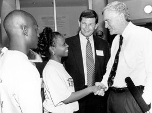 Florida Gov. Lawton Chiles, right, shakes hands with IRCC students during a tour of the new Science Center with President Ed Massey in 1994