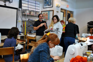 Michael Naffziger organizes a sewing class