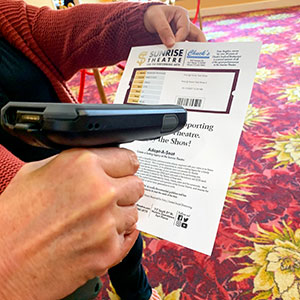 A scanner reads the code on a ticket