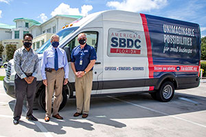 Elijah Wooten, business navigator for the city, City Manager Russ Blackburn and Tom KIndred, regional director of the Florida SBDC at IRSC