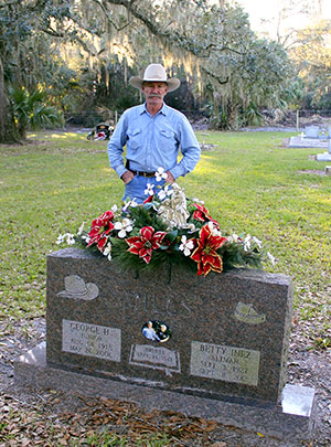 Buddy Mills at the graves of his parents