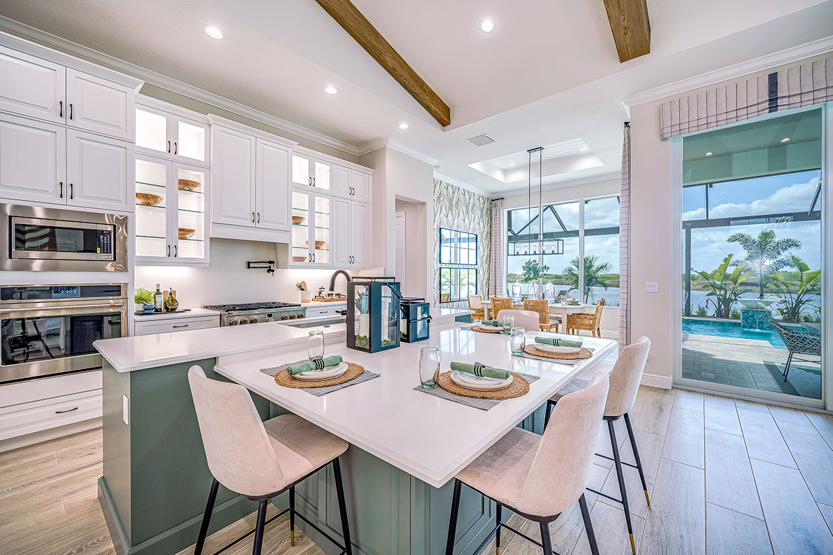 The large and functionally designed kitchen area, as seen in the Willow Signature model, features 42-inch cabinets, quartz or granite counter tops, and a full complement of stainless-steel appliances as standard.