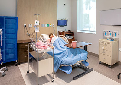 Simulated pregnant patient at IRSC nursing building