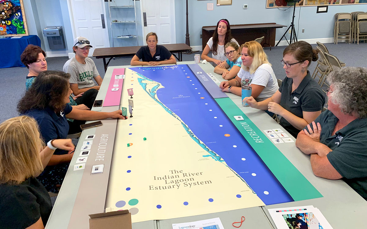 Staff at the Marine Resources Council tries out the game. While aimed at middle school students, Lagoonology has proven popular with adults, too