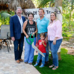 St. Lucie County commissioners Larry Leet and Cathy Townsend welcome Cabo Rio RV Resort co-owners Jim and Carrie Chalmers and son Callan at a chamber of commerce ribbon-cutting ceremony on June 7.