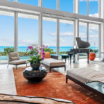 Floor to ceiling glass offers spectacular views of the Atlantic Ocean,