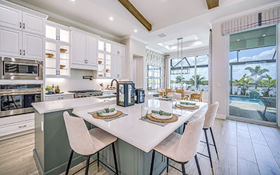 The large and functionally designed kitchen area, as seen in the Willow Signature model, features 42-inch cabinets, quartz or granite counter tops, and a full complement of stainless-steel appliances as standard.