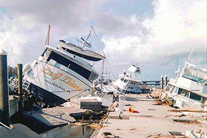 Hurricanes Jeanne and Frances in the fall of 2004 destroyed the outer docks and boats at the Fort Pierce City Marina. The Lady Diane from Philadelphia and others lie tipped on their sides and the water is filled with debris.