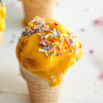 This refreshing dessert showcases the vibrant color and tropical flavor of mangos.