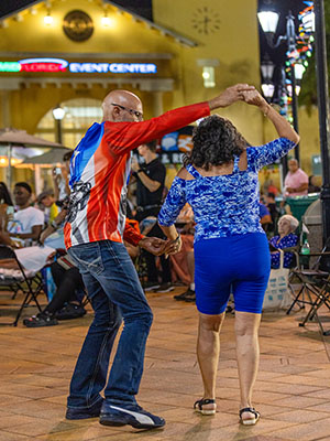 Dancers enjoy themselves at the annual International Festival designed to make friends out of strangers and help cement the idea that the city is a place with a high quality of life for all.
