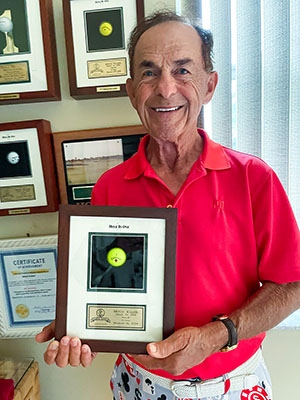 Golfing awards line the wall of the 94-year-old’s Port St. Lucie home