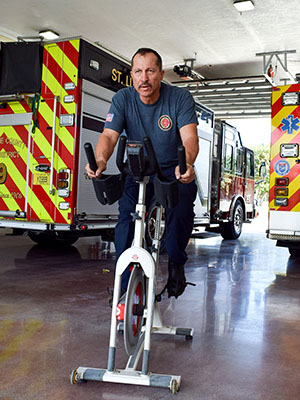 During downtime with the fire department, Santa exercises to stay in shape, hoping to teach Bando classes again soon.