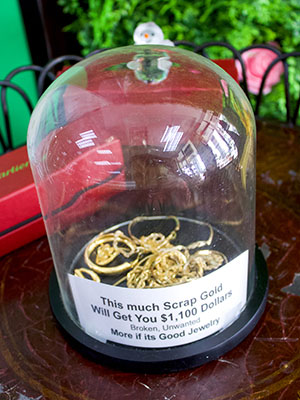 A simple display jar helps customers visualize how much their gold could be worth in actual dollars.