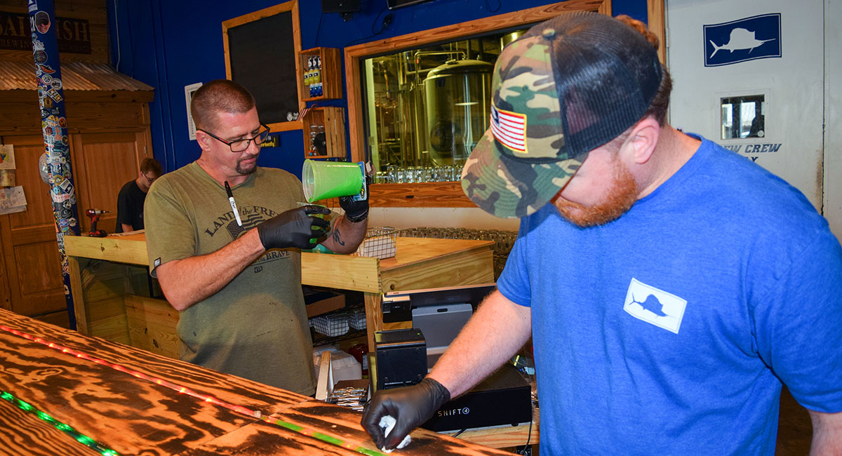 Books are lined up on shelves awaiting readers at Wanderlust Book Boutique. The store offers children’s books as well as novels in various genres. A book club meets there monthly.