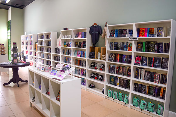 Books are lined up on shelves awaiting readers at Wanderlust Book Boutique. The store offers children’s books as well as novels in various genres. A book club meets there monthly.