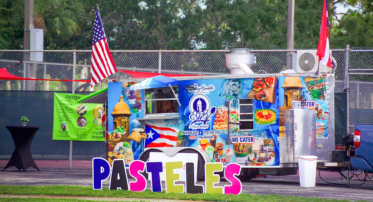 The colorful El Hay Bendito food truck features Puerto Rican pasteles and other delicious treats.