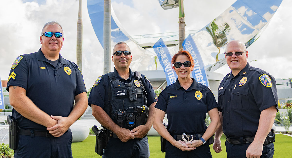 Officers at the ribbon-cutting ceremony for the heart sculpture.